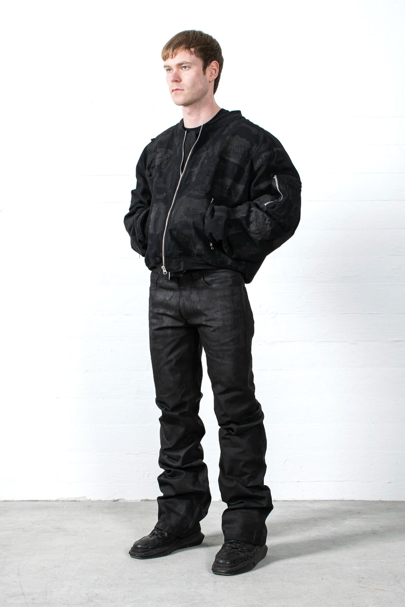COATED STACKED JEANS